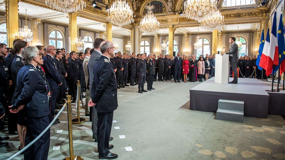 PHOTO: French President Emmanuel Macron delivers a speech for the Parisian Firefighters' brigade and security forces who took part at the fire extinguishing operations during the Notre Dame Cathedral fire, at Elysee Palace in Paris, April 18, 2019.