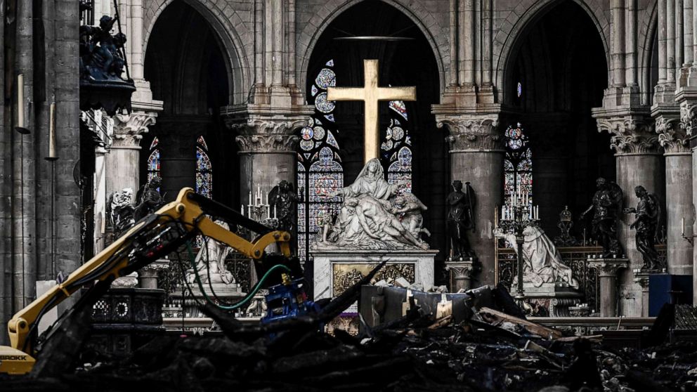 PHOTO: Rubble sits around the cross at the altar inside the the Notre Dame de Paris Cathedral after it sustained major fire damage, May 15, 2019.