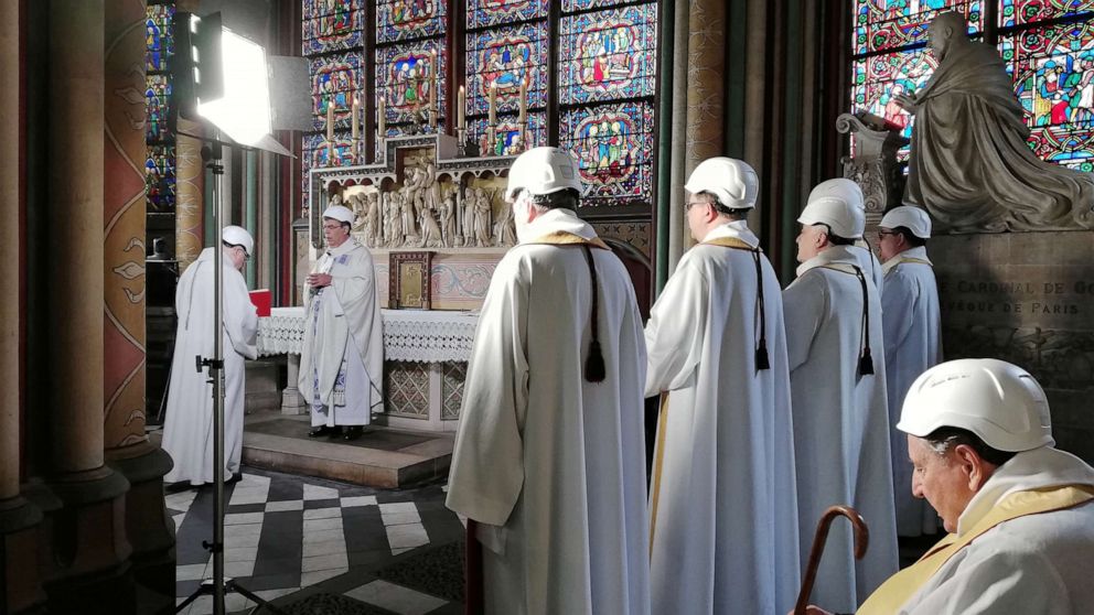 Notre Dame Cathedral holds first mass since devastating fire, with attendees in hardhats 