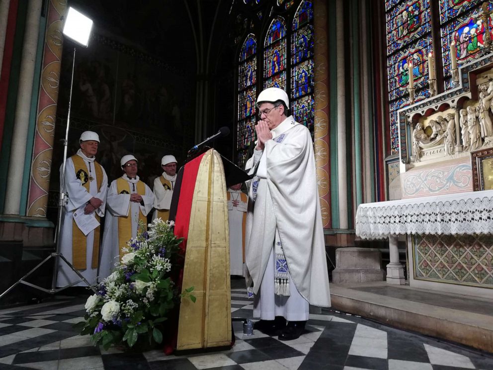 PHOTO:Clerics attend a mass led by Michel Aupetit Archbishop of Paris, which is the first church service in a side chapel of Notre-Dame de Paris cathedral in Paris, June 15, 2019, two months to the day after a devastating fire.