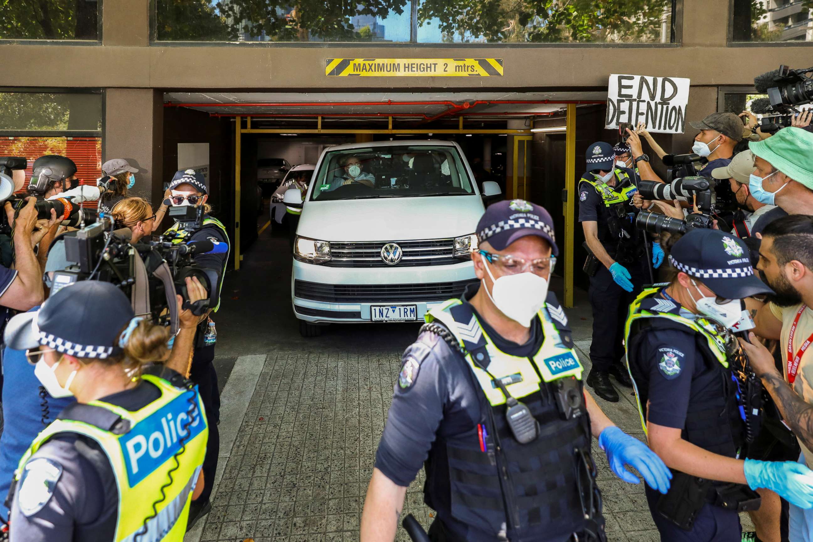 PHOTO: Members of the media waiting for a sighting of Serbian tennis player Novak Djokovic surround a departing transport vehicle exiting the Park Hotel in Melbourne, Australia, on Jan. 10, 2022.