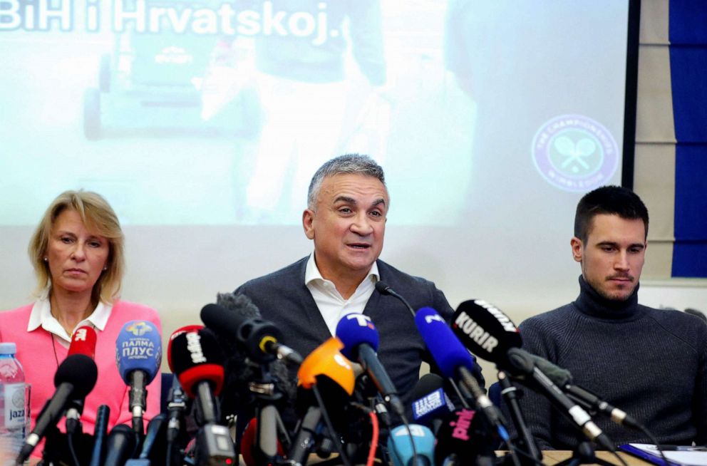 PHOTO: Serbian tennis player Novak Djokovic's (L-R) mother Dijana, father Srdjan and brother Djordje hold a press conference in Belgrade, on Jan. 10, 2022.