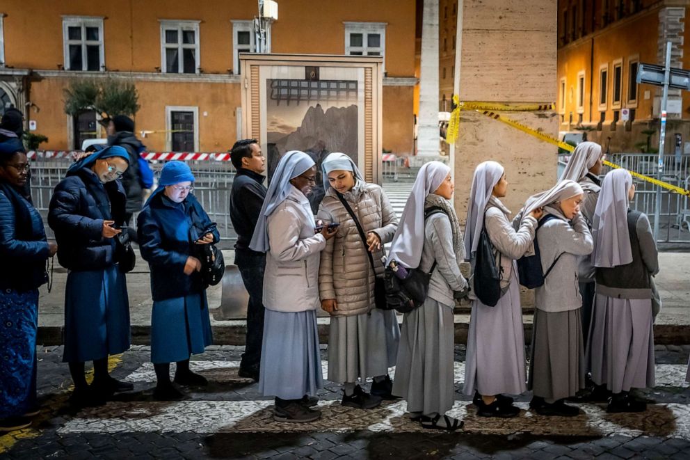 PHOTO: Nuns queue before dawn to view the body of Pope Emeritus Benedict XVI as it lies in state in St. Peter's Basilica at the Vatican, Jan. 3, 2023.