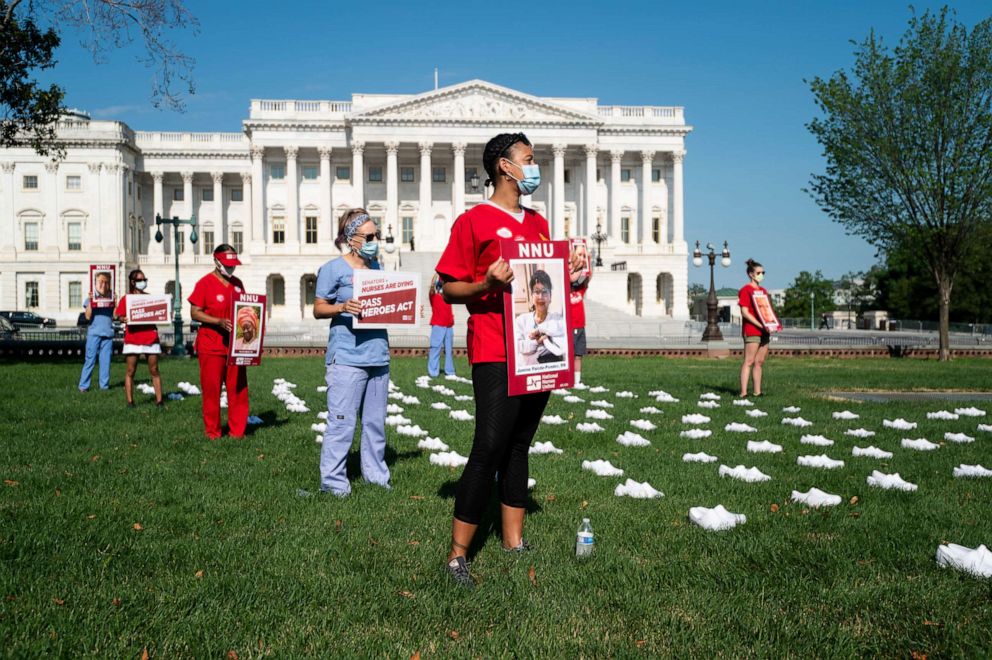 PHOTO: National Nurses United (NNU) holds a memorial, July 21, 2020, to honor the nurses who have lost their lives from COVID-19 in the United States, and to call on the U.S. Senate to pass the Heroes Act, in Washington, DC.