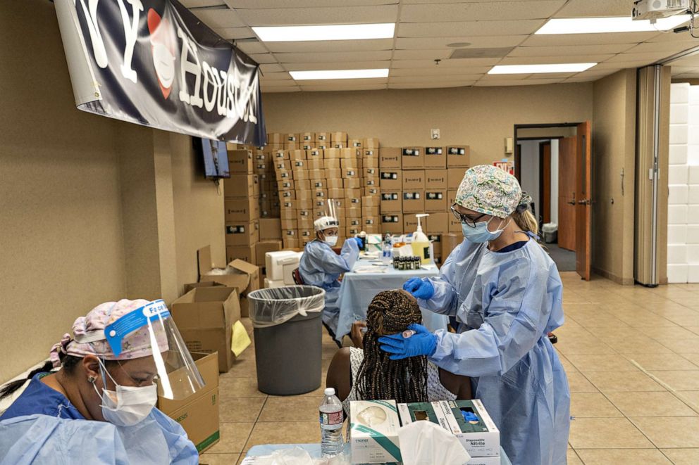 PHOTO: New York Medical workers test for COVID-19 at a temporary testing site in Higher Dimensions Church,  July 17, 2020 in Houston.