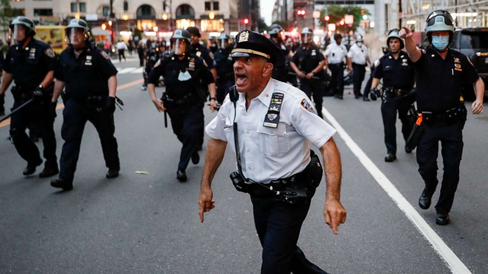 PHOTO: NYPD officers move in to arrest protesters for violating curfew beside the iconic Plaza Hotel on 59th Street, June 3, 2020, in the Manhattan borough of New York City.