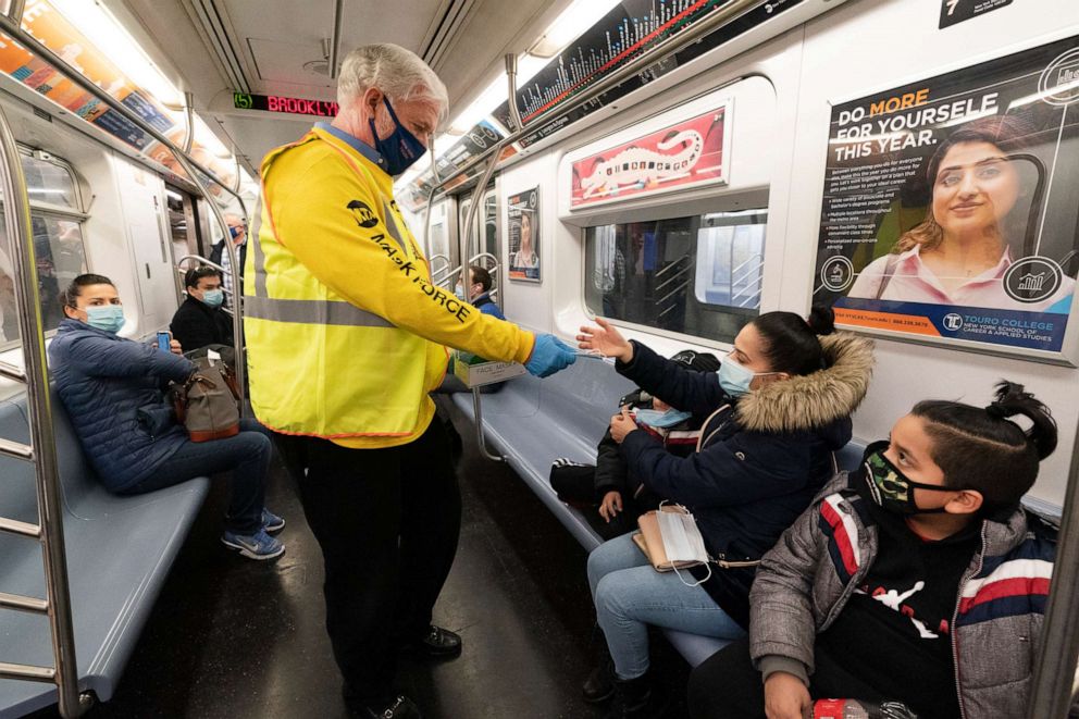 PHOTO: Patrick Foye, Chairman and CEO of the MTA, hands out face masks on a New York subway, Nov. 17, 2020.