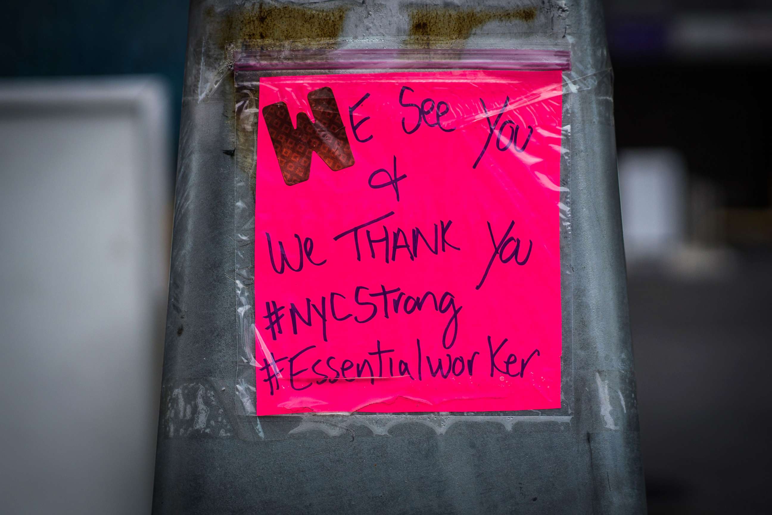 PHOTO: A message seen outside Bellevue hospital in Manhattan, where refrigerated trucks have been set up as makeshift morgues, in New York City, March 31, 2020.
