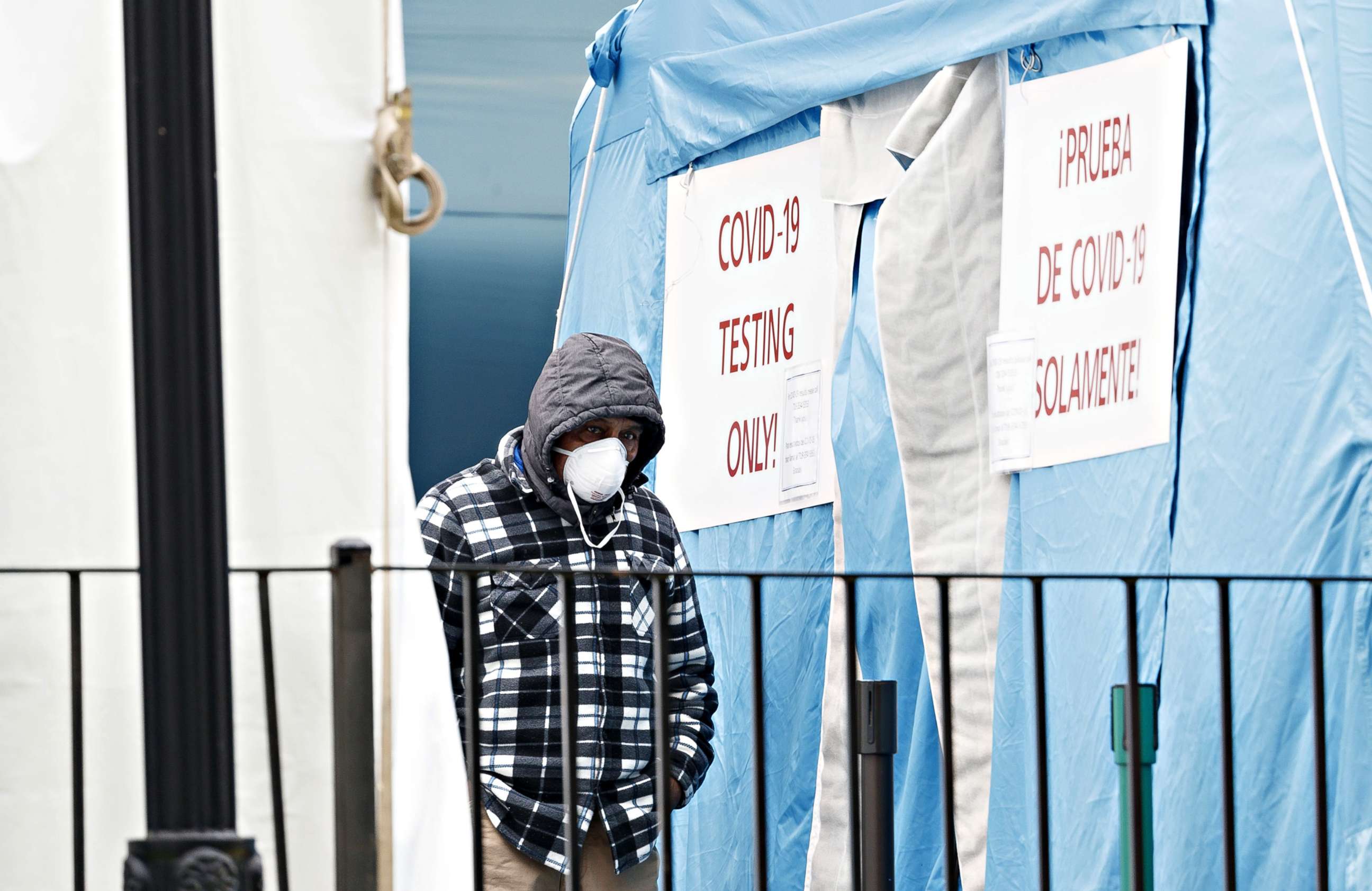 PHOTO: A man waits to enter a COVID-19 testing center at the Elmhurst Hospital Center in Queens, New York, USA, on March 30, 2020.