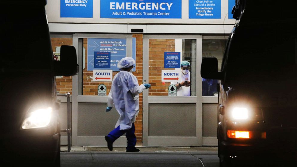 PHOTO: Medical workers walk outside of a special coronavirus intake area at Maimonides Medical Center, May 4, 2020 in the Brooklyn borough of New York City.