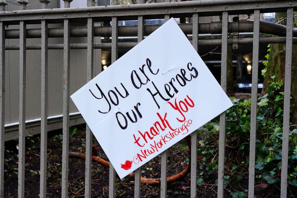 PHOTO: A sign on a fence outside NewYork-Presbyterian Hospital/Weill Cornell Medical Center reads, "You are our Heroes," during the coronavirus pandemic, April 13, 2020 in New York City.