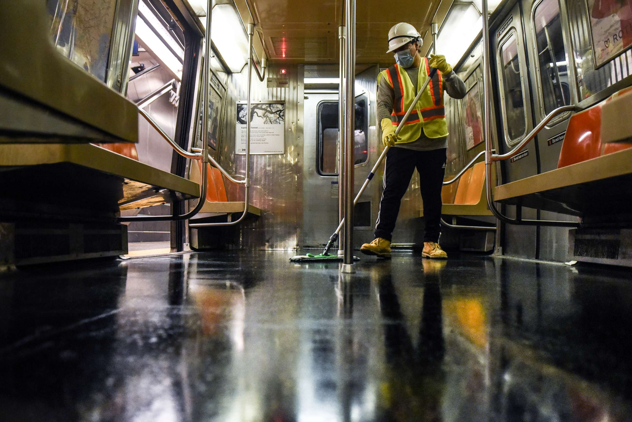 PHOTO: A cleaning crew disinfects a New York City subway train on May 4, 2020 in New York City. 