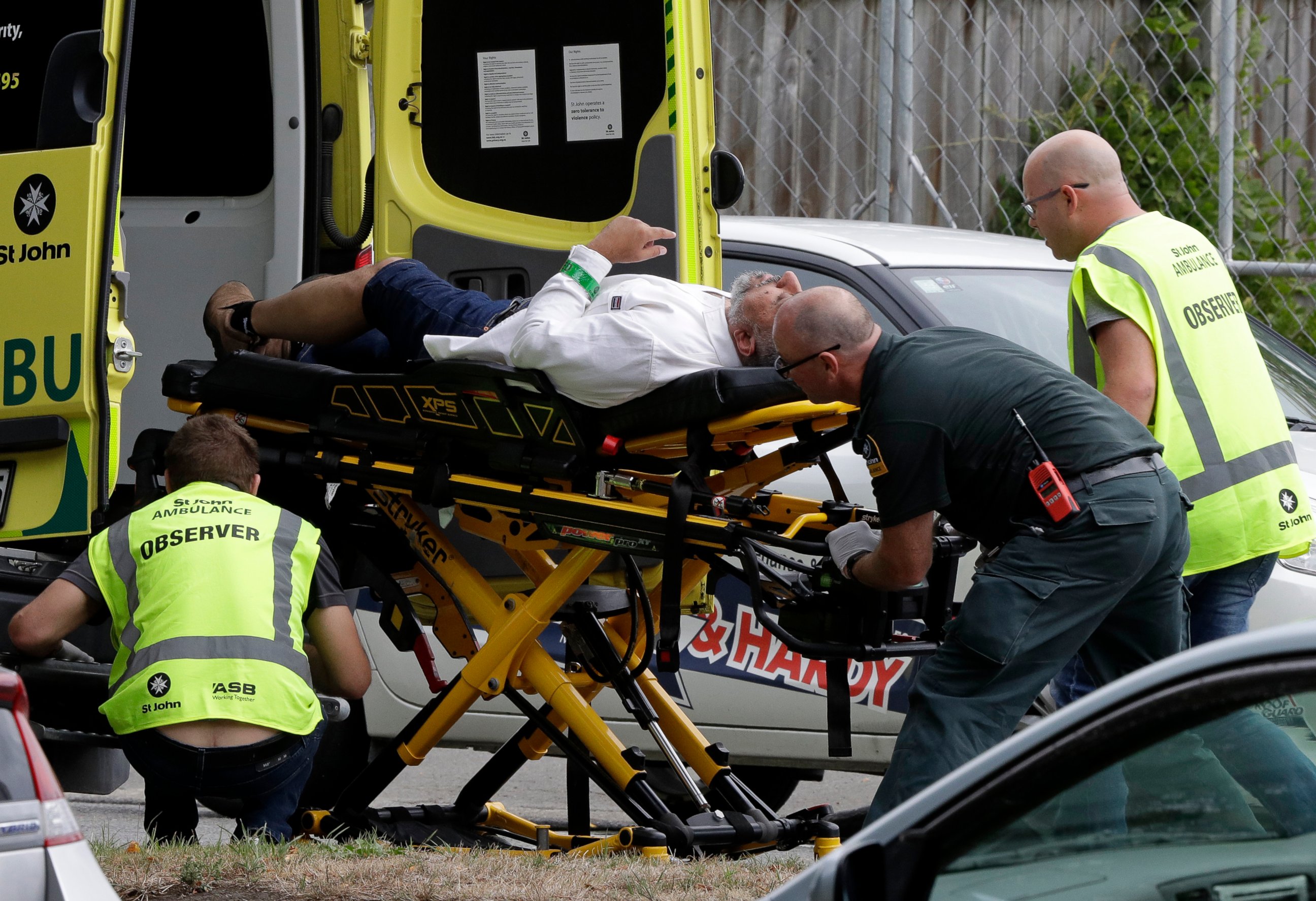 PHOTO: Ambulance staff take a man from outside a mosque in central Christchurch, New Zealand, Friday, March 15, 2019. A witness says many people have been killed in a mass shooting at a mosque in the New Zealand city of Christchurch.