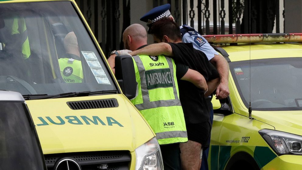 PHOTO: Police and ambulance staff help a wounded man from outside a mosque in central Christchurch, New Zealand, Friday, March 15, 2019. A witness says many people have been killed in a mass shooting at a mosque in the New Zealand city of Christchurch.