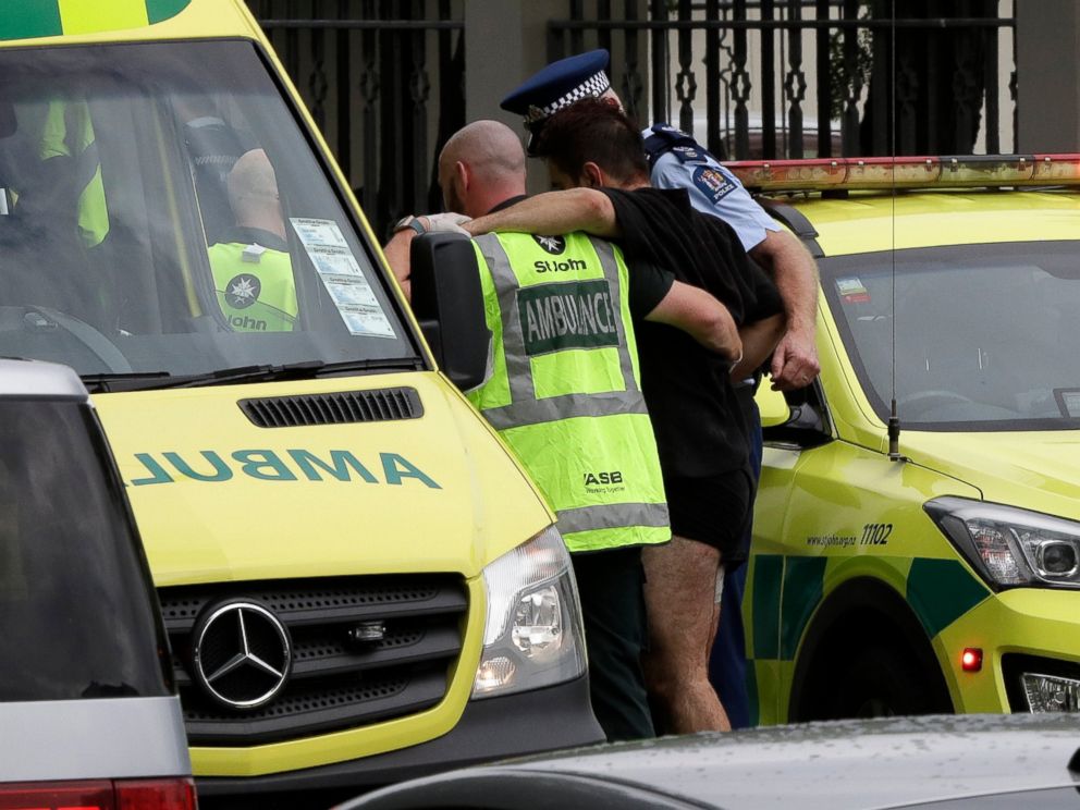 PHOTO: Police and ambulance staff help a wounded man from outside a mosque in central Christchurch, New Zealand, Friday, March 15, 2019. A witness says many people have been killed in a mass shooting at a mosque in the New Zealand city of Christchurch.