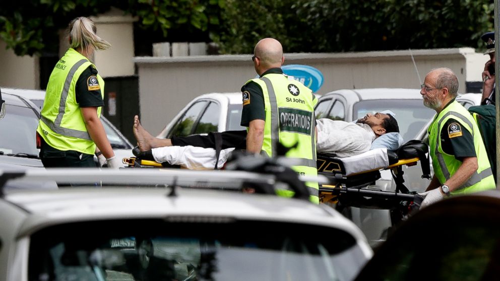 PHOTO: Ambulance staff take a man from outside a mosque in central Christchurch, New Zealand, Friday, March 15, 2019. A witness says many people have been killed in a mass shooting at a mosque in the New Zealand city of Christchurch.