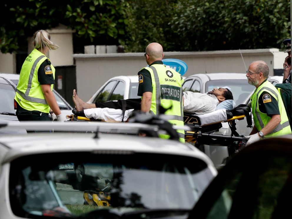 PHOTO: Ambulance staff take a man from outside a mosque in central Christchurch, New Zealand, Friday, March 15, 2019. A witness says many people have been killed in a mass shooting at a mosque in the New Zealand city of Christchurch.