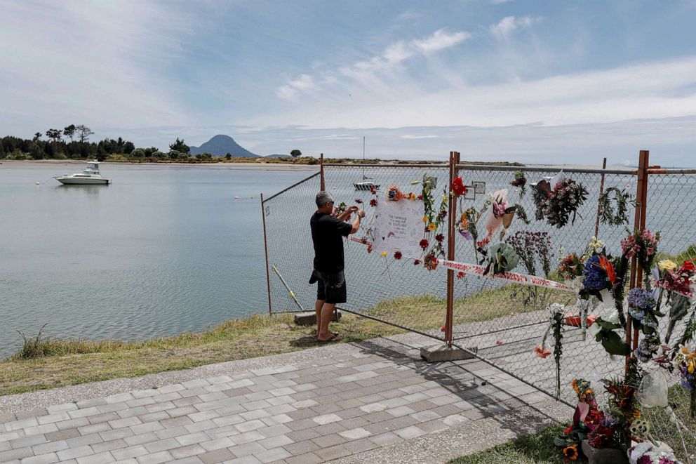 PHOTO: A man contributes to a memorial at the harbour in Whakatane, following the White Island volcano eruption in New Zealand, Dec. 11, 2019.