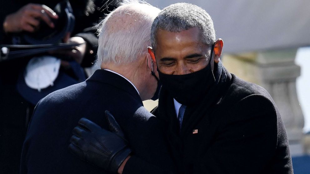 PHOTO: Former President Barak Obama, right, congratulates President Joe Biden after he was sworn in, on Jan. 20, 2021 at the US Capitol in Washington.