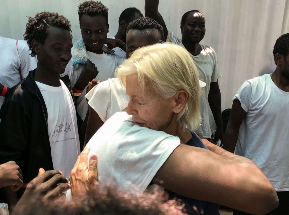 PHOTO: MSF nurse Marion hugs a migrant as they celebrate aboard the 'Ocean Viking' rescue ship on August 23, 2019, as six EU countries agreed to take them in after 14 days at sea.