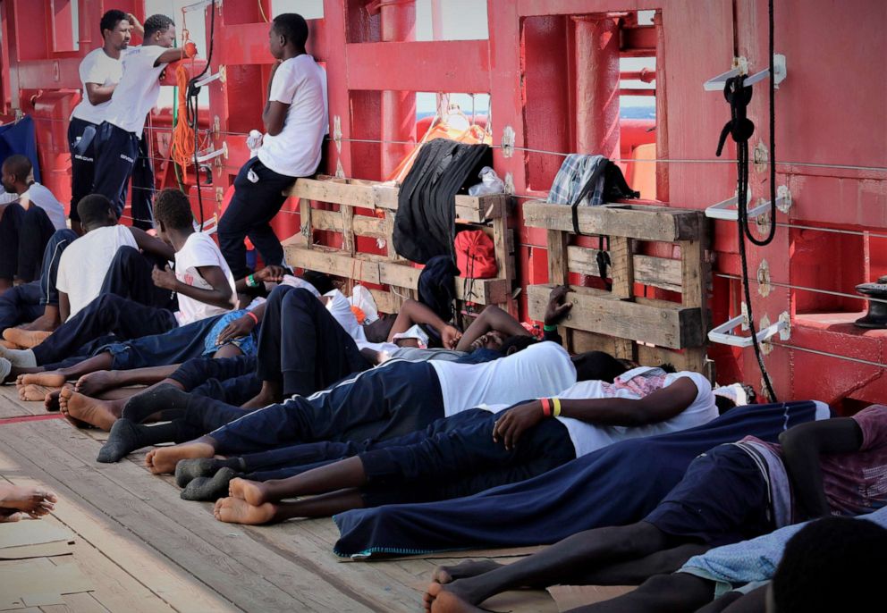 PHOTO:In this Aug. 13, 2019 photo made available Monday, Aug. 19, 2019, rescued migrants rest on the deck of the Norwegian-flagged Ocean Viking vessel.