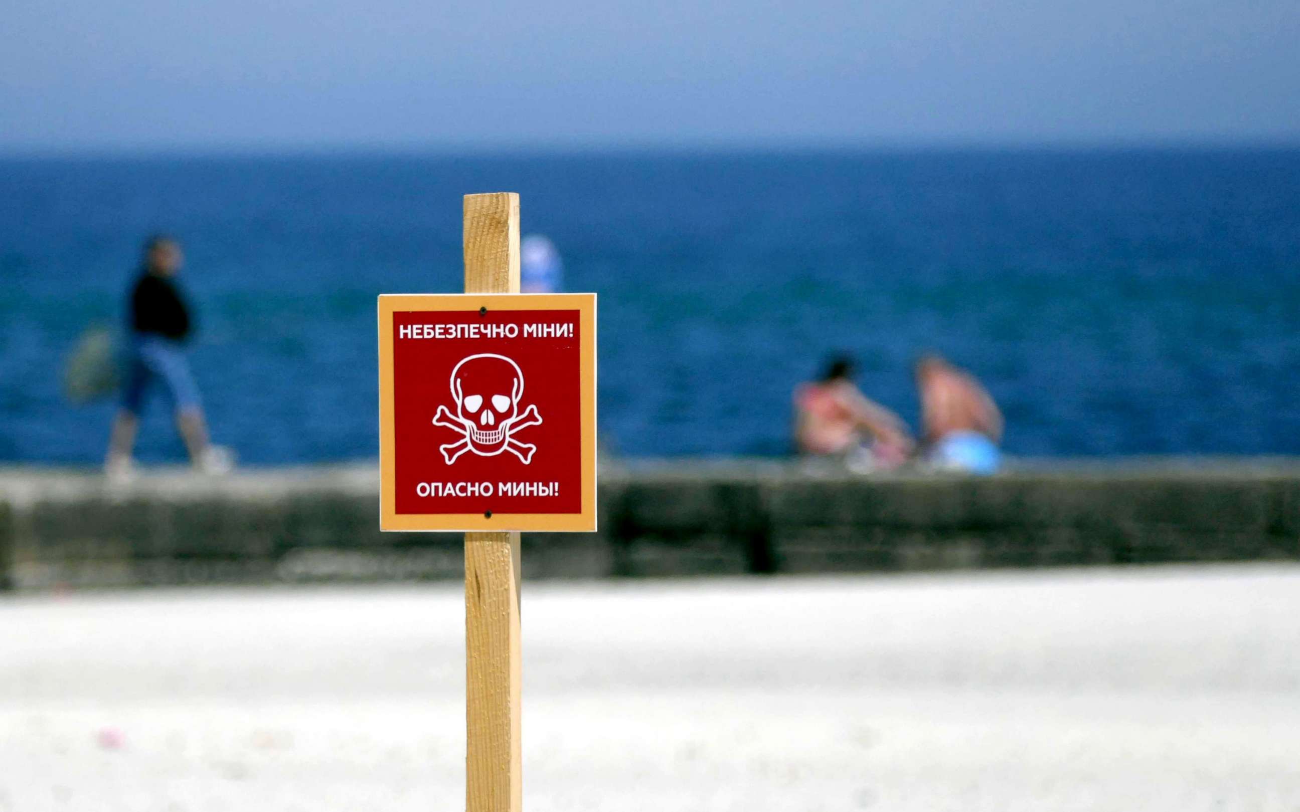 PHOTO: A sign warning of "Mines Danger" is displayed at a beach in Odessa, southern Ukraine, May 28, 2022.