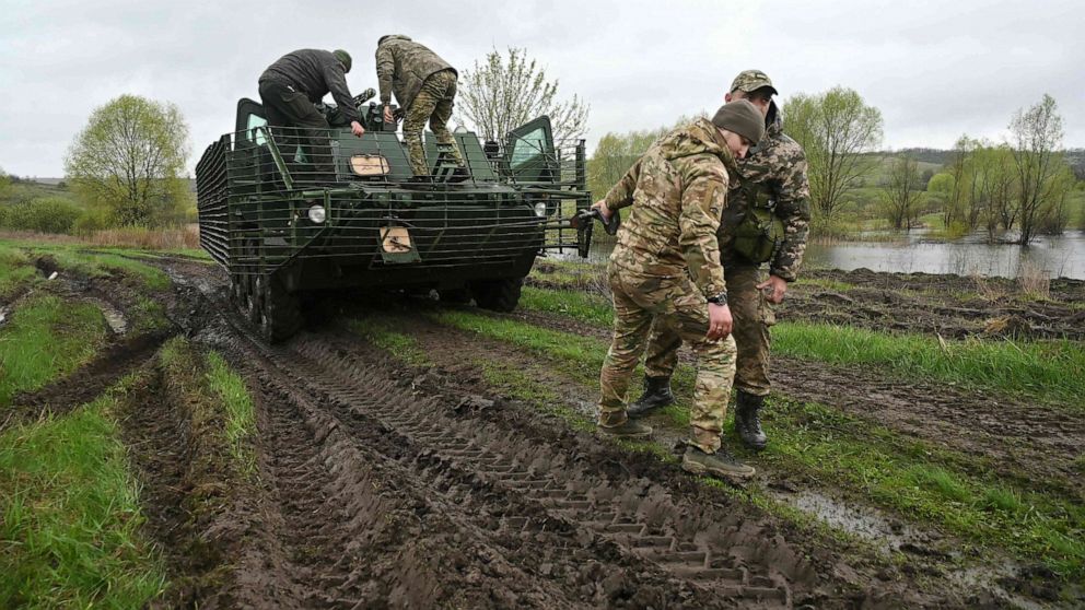 PHOTO: Volunteers of the "Spartan" assault brigade of the National Guard of Ukraine, which is part of the "Offensive Guard", take part in driving and evacuation lessons during training exercises in the Kharkiv region on April 21, 2023.