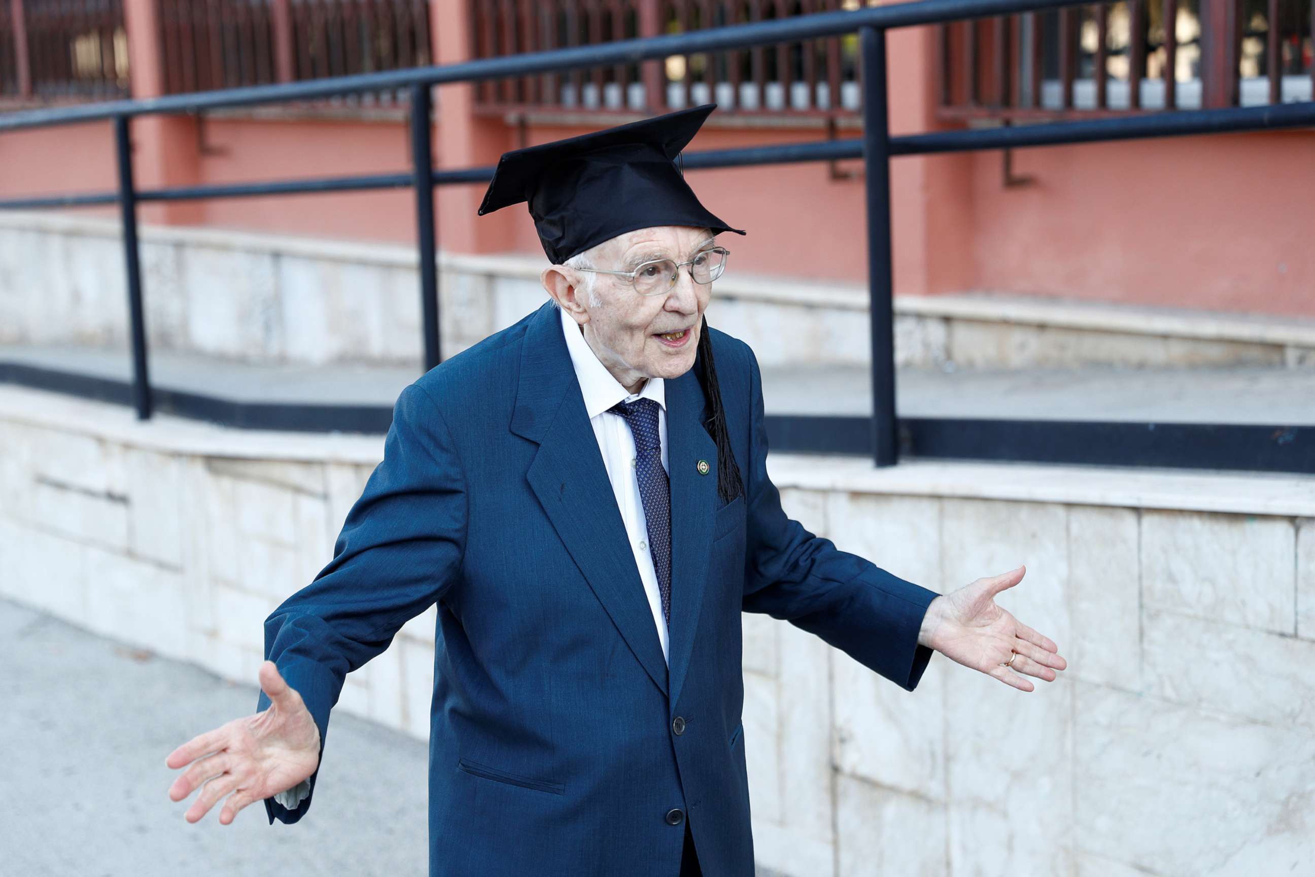 PHOTO: Giuseppe Paterno, 96, Italy's oldest student, celebrates after graduating from his undergraduate degree in history and philosophy during his graduation at the University of Palermo, in Palermo, Italy, July 29, 2020. 