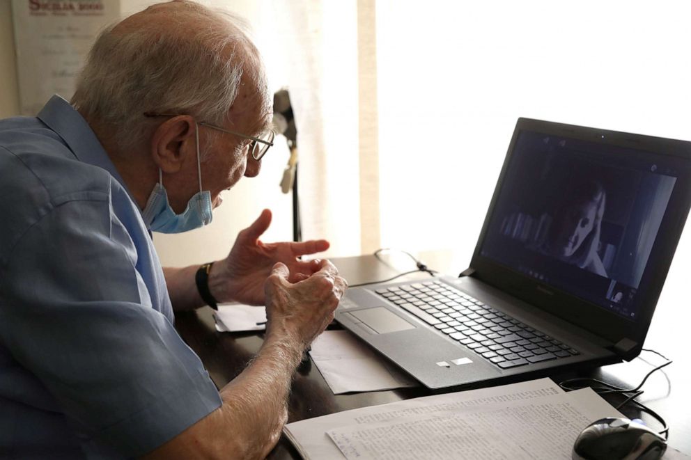 PHOTO: Giuseppe Paterno, 96, Italy's oldest student, takes his final exam online, for his undergraduate degree that he has been studying at the University of Palermo, using a laptop at his home, in Palermo, Italy, June 23, 2020. 