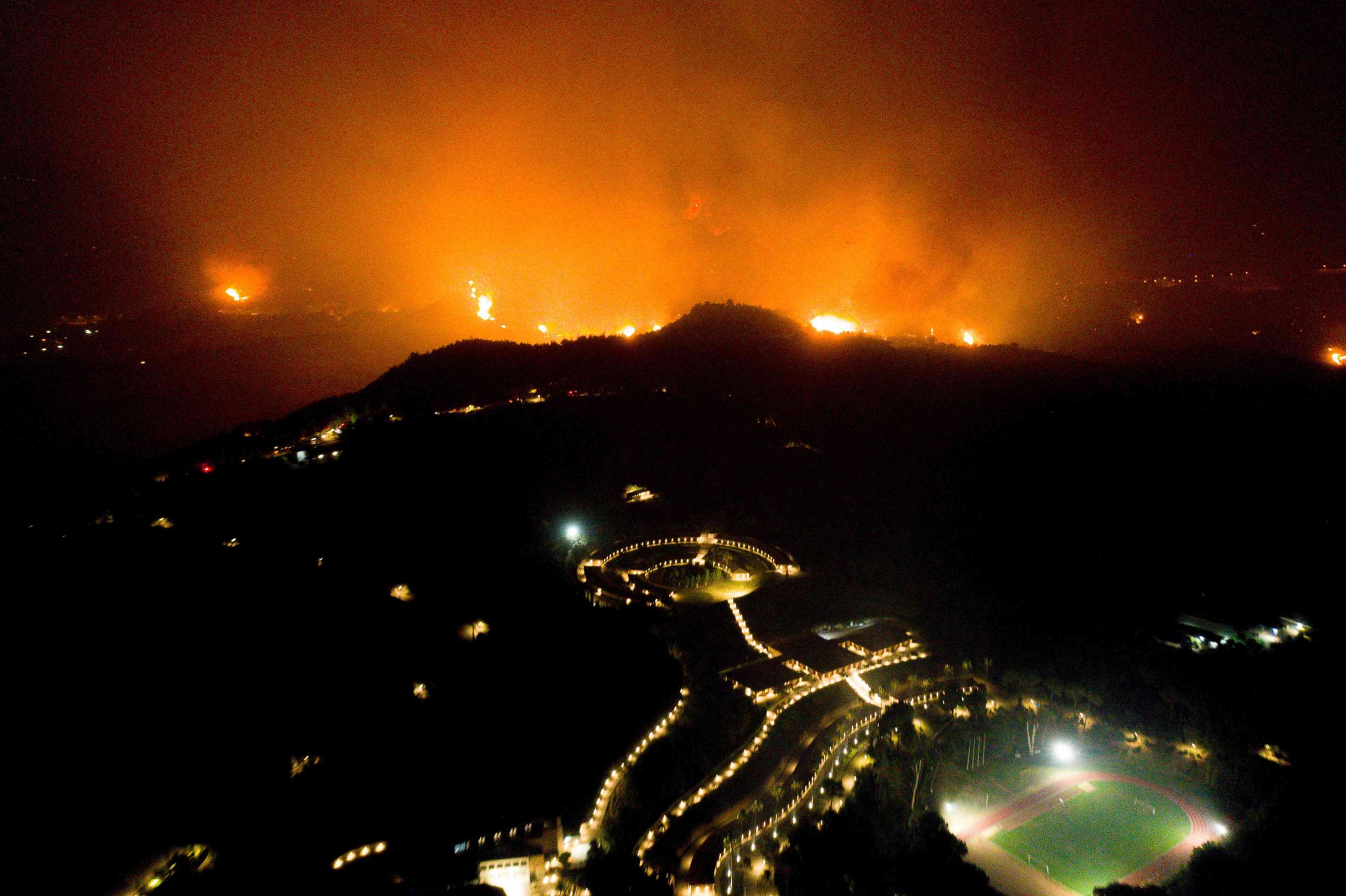 PHOTO:A wildfire approaches the Olympic Academy in ancient Olympia in western Greece, Aug. 4, 2021.