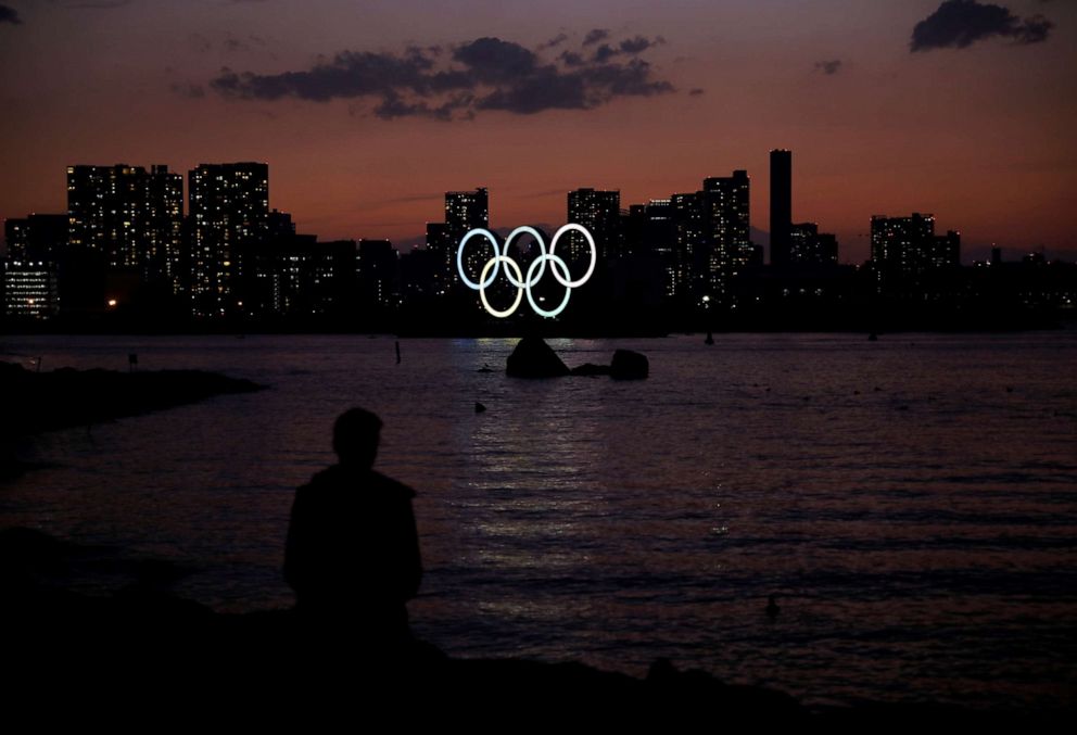 PHOTO: The giant Olympic rings are seen in the dusk at the waterfront area at Odaiba Marine Park in Tokyo, Japan, on March 22, 2020.