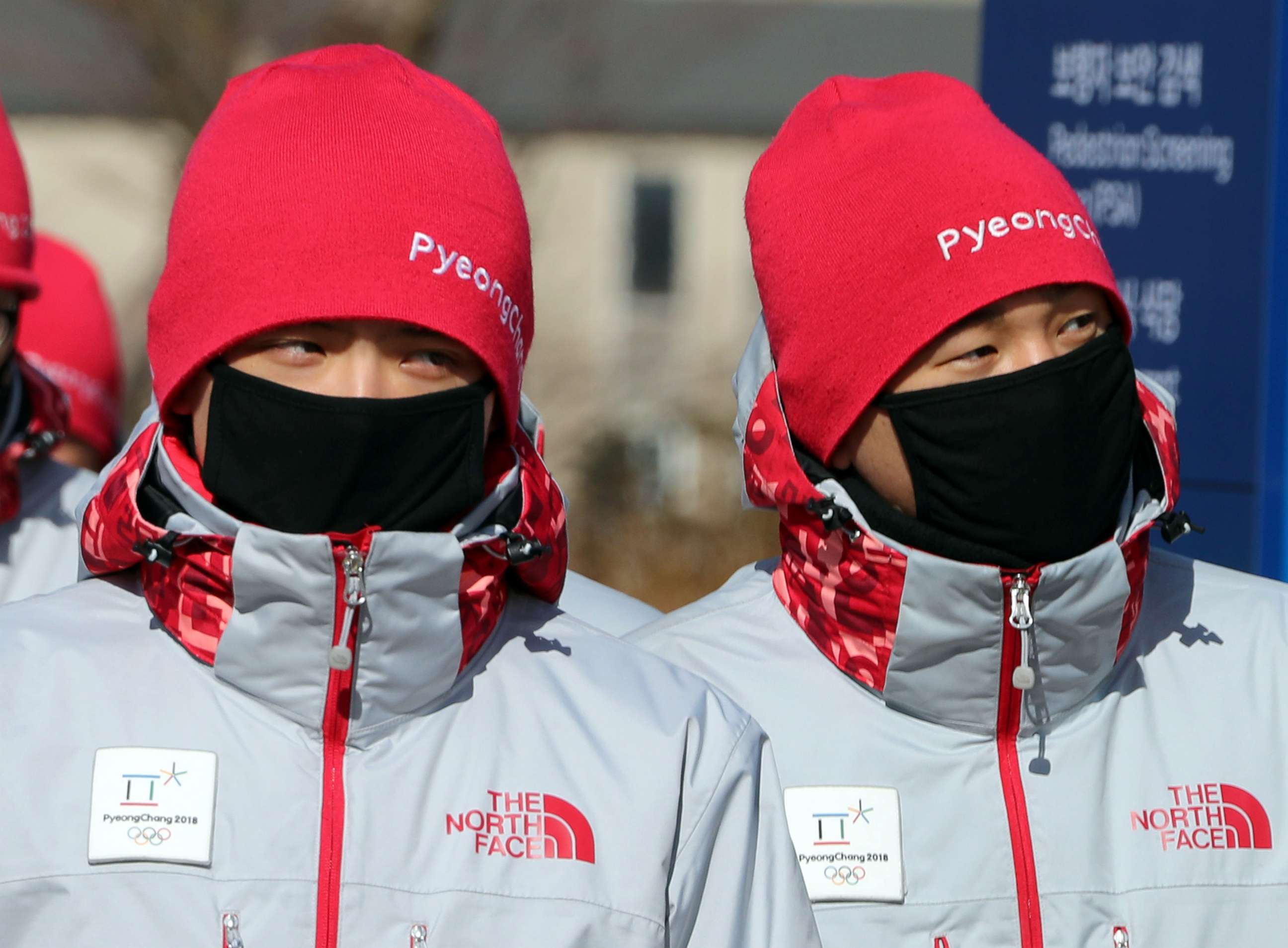 PHOTO: Volunteers protect their faces from the cold at the Olympic stadium of the Pyeongchang Winter Olympic Games in Pyeongchang, South Korea Feb. 7, 2018.