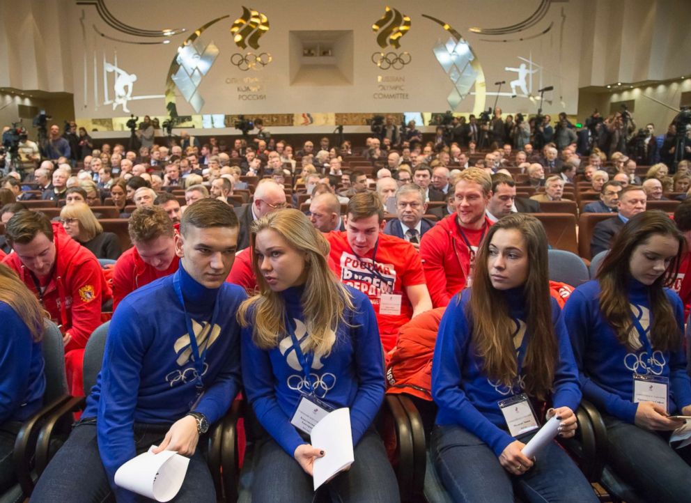 PHOTO: Russian short track athletes, first row, and ice hockey players with the words 'Russian is in my heart' on their red sweatshirts attend an Russian Olympic committee meeting in Moscow, Dec. 12, 2017. 