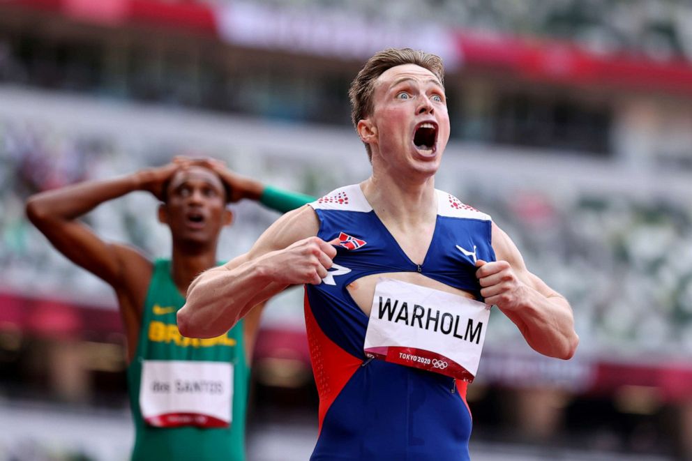 PHOTO: Karsten Warholm of Norway reacts after crossing the line to win gold in the 400m hurdles on Aug. 3, 2021 in Tokyo.