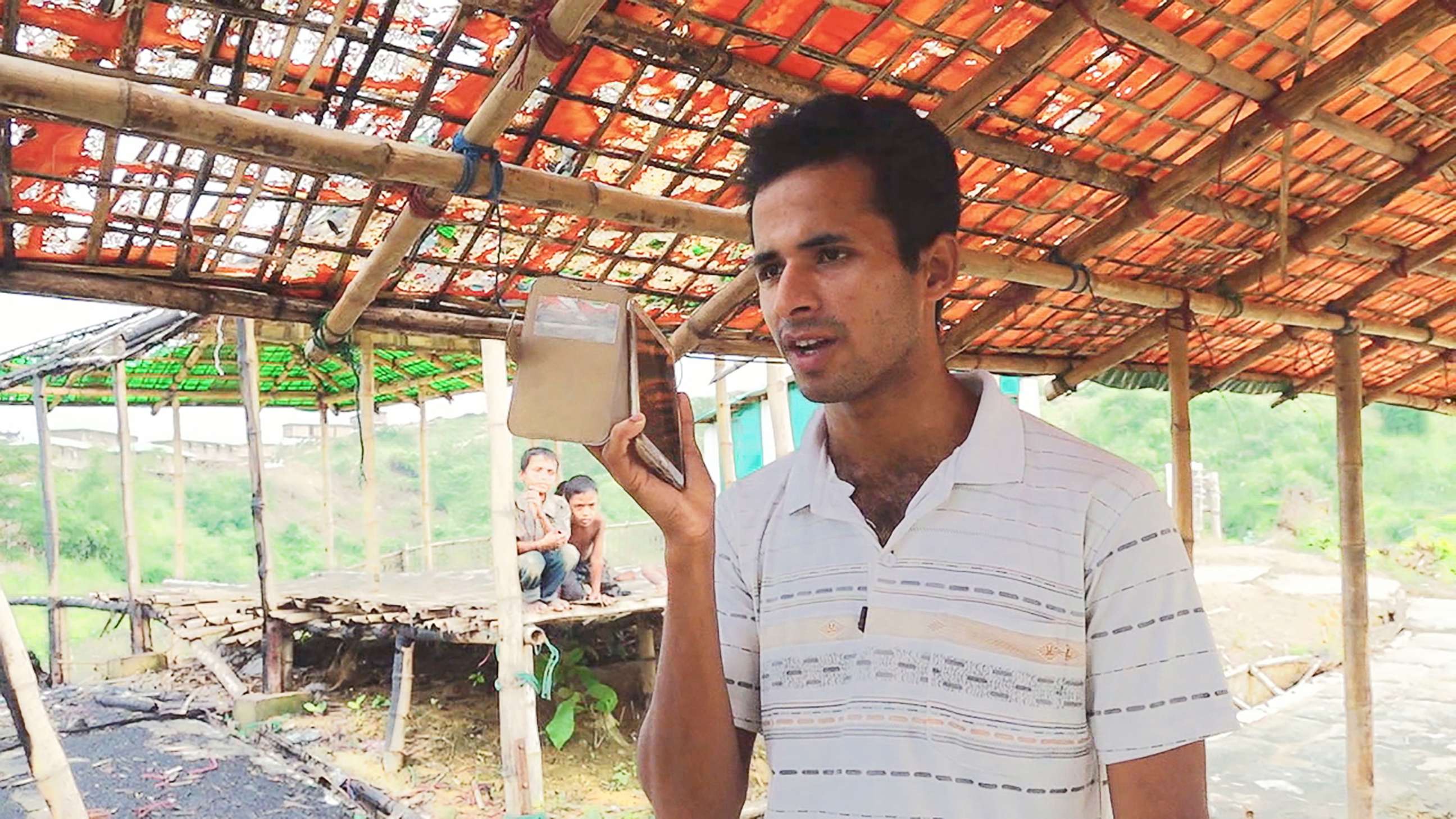 PHOTO: Omar Faruk, who lives in Bangladesh's Chakmarkul camp, called his grandfather in Myanmar to check on his safety, in Nov. 2018.
