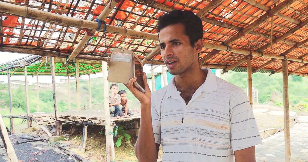 Omar Faruk, who lives in Bangladesh's Chakmarkul camp, called his grandfather in Myanmar to check on his safety, in Nov. 2018.