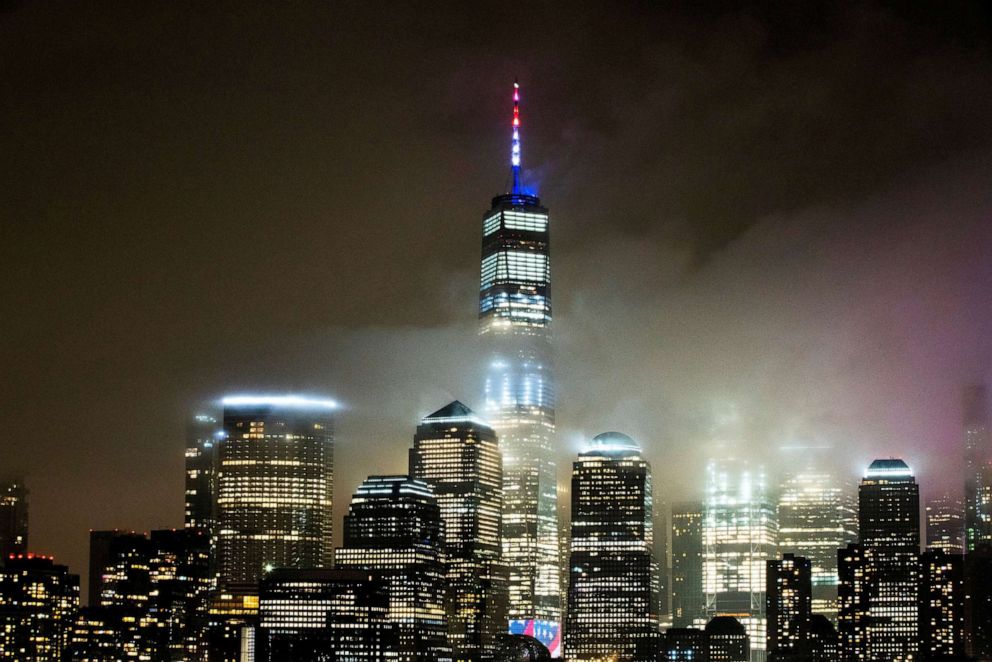 PHOTO: One World Trade Center is illuminated in red, white and blue in recognition of the ongoing nationwide effort to combat coronavirus (COVID-19) in New York City, as seen from Exchange Place, New Jersey, March 30, 2020.