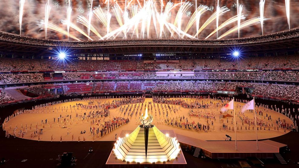 PHOTO: Naomi Osaka of Team Japan lights the Olympic cauldron with the Olympic torch during the Opening Ceremony of the Tokyo 2020 Olympic Games at Olympic Stadium on July 23, 2021 in Tokyo, Japan.