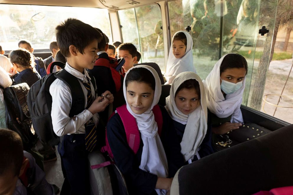 PHOTO: Samira, 9, and other children from the orphanage, ride the bus to school in Kabul, Afghanistan, Oct. 12, 2021. 