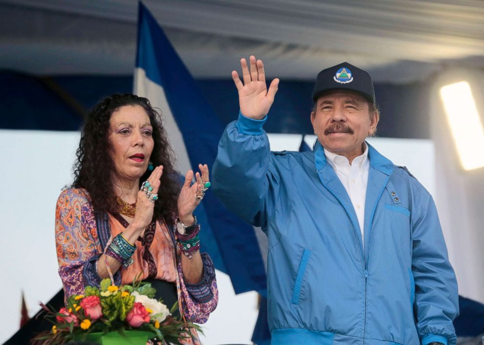 PHOTO: Nicaraguan President Daniel Ortega waves to supporters, next to his wife and Vice President Rosario Murillo, during a march in honor of Salvadoran blessed Monsignor Oscar Arnulfo Romero, on the eve of his canonization, in Managua, Oct. 13, 2018.
