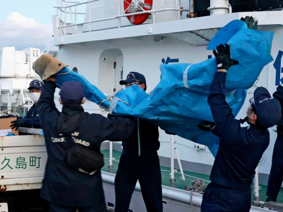 PHOTO: The members of Japanese Coast Guard carry the debris which are believed to be from the crashed U.S. military Osprey aircraft, at a port in Yakushima, Kagoshima prefecture, southern Japan, Monday, Dec. 4, 2023