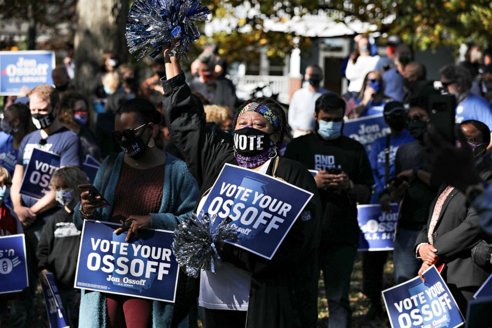 PHOTO: Supporters listen as Democratic U.S. Senate candidate Jon Ossoff speaks at a news conference in Grant Park after the election in Atlanta, Nov. 6, 2020.