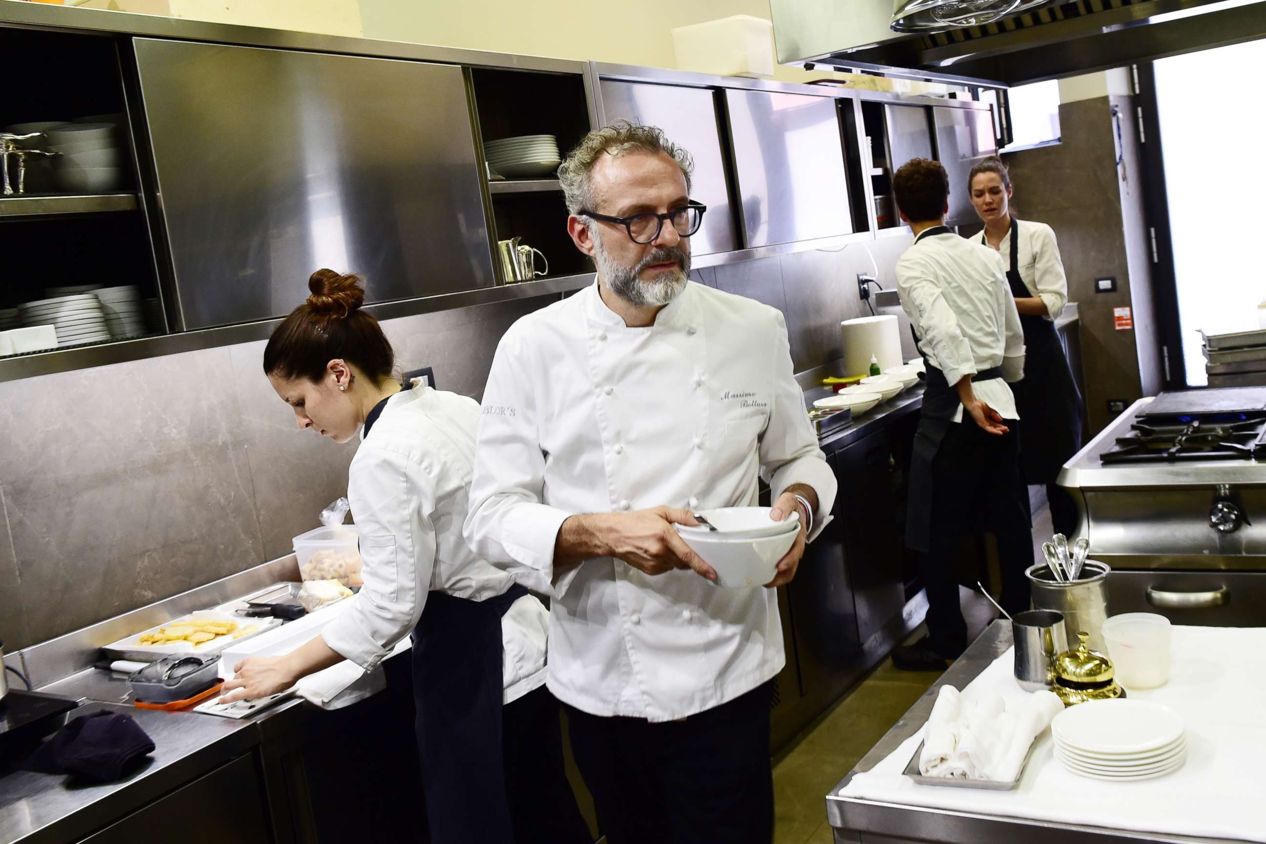 PHOTO: A picture taken on July 7, 2016 shows Italian chef Massimo Bottura working in the kitchen of his restaurant Osteria Francescana in Modena, Italy.