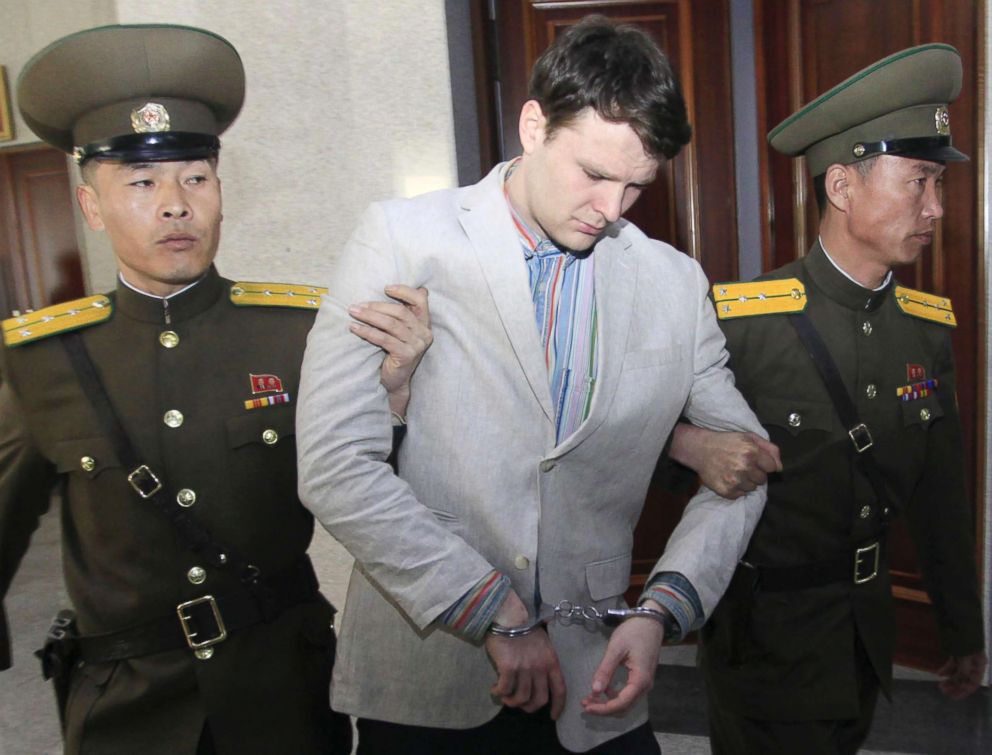 PHOTO: American student Otto Warmbier, center, is escorted at the Supreme Court in Pyongyang, North Korea, on March 16, 2016.