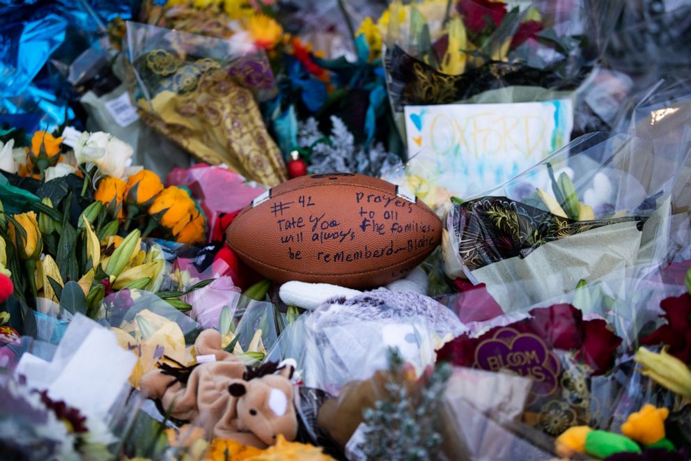 PHOTO: A football is seen placed at the memorial outside of Oxford High School on Dec. 7, 2021, in Oxford, Mich.