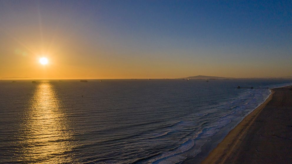 PHOTO: The sun sets over the Pacific ocean in Huntington Beach, Calif., Feb. 17, 2021. ocean at