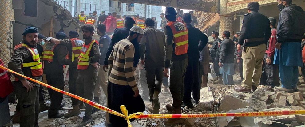 PHOTO: Security officials and rescue workers search bodies at the site of suicide bombing, in Peshawar, Pakistan, Jan. 30, 2023.