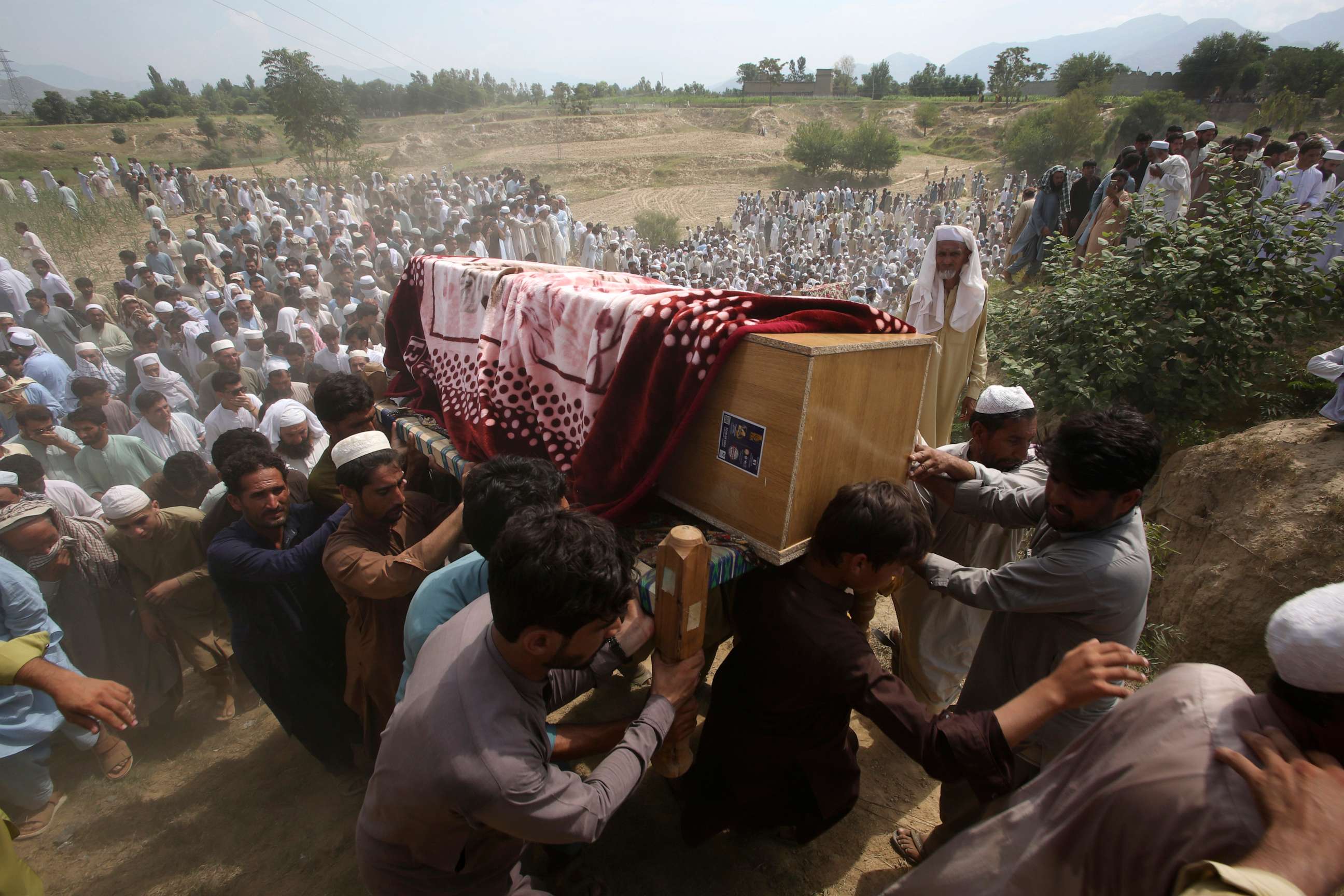 PHOTO: Relatives and mourners carry the casket of a victim, who was killed in Sunday's suicide bomber attack in the Bajur district of Khyber Pakhtunkhwa, Pakistan, Monday, July 31, 2023.