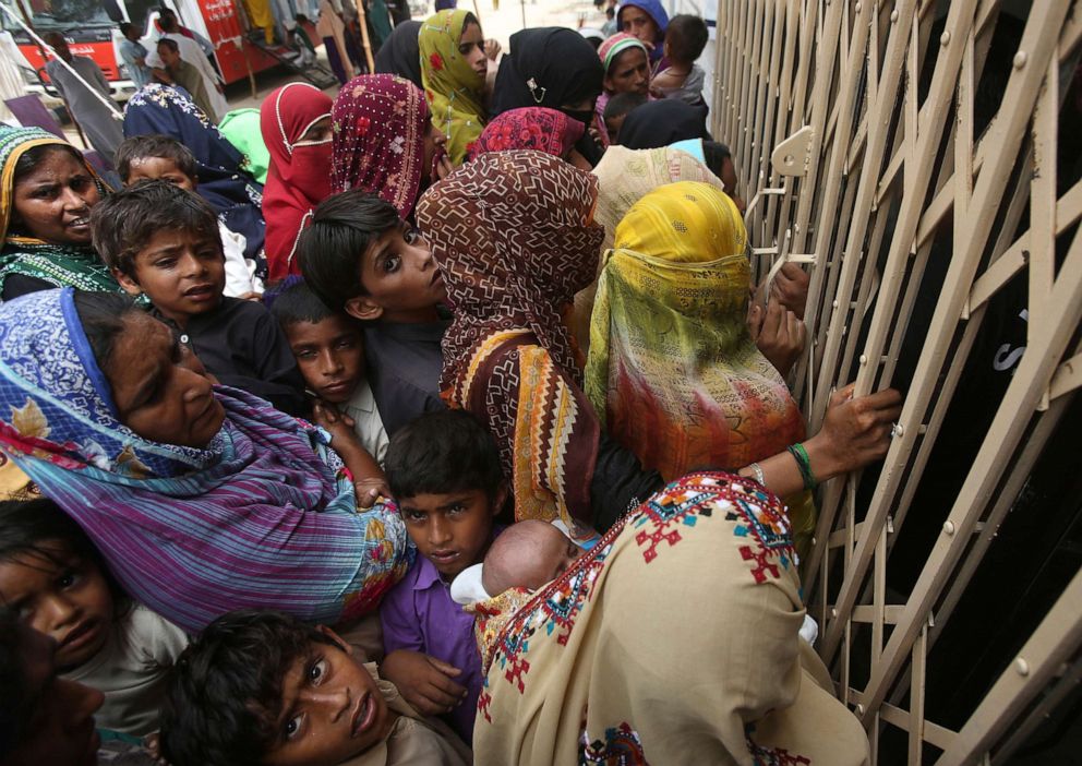 PHOTO: Villagers wait outside a hospital for blood screening in the southern province of Sindh, Pakistan, May 16, 2019, where about 500 people, mostly children, have tested positive for HIV.