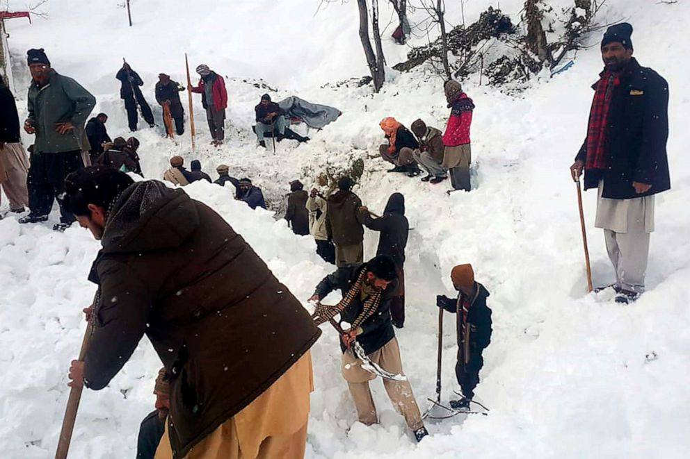 PHOTO: Local residents search for victims in the snow after an avalanche in Neelum Valley in the Pakistan-controlled portion of Kashmir on Jan. 15, 2020.